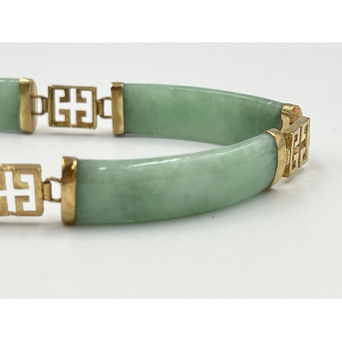 2235 - An Oriental yellow metal and jade panel bracelet - approx. gross weight 14.7g and 18cm long