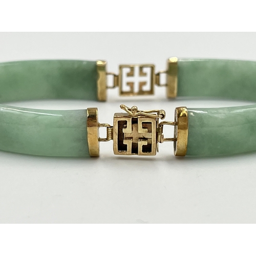 2235 - An Oriental yellow metal and jade panel bracelet - approx. gross weight 14.7g and 18cm long