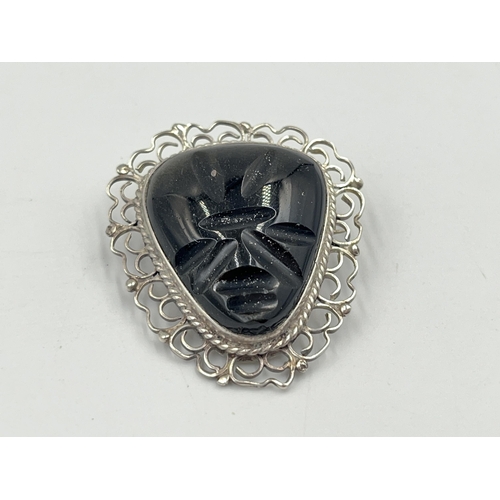 2241 - A Mexican sterling silver and carved golden sheen obsidian brooch