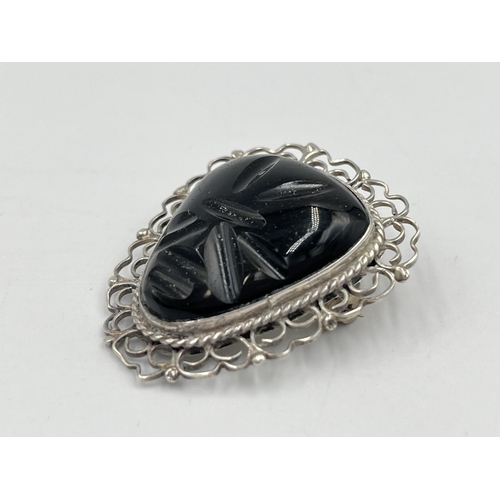 2241 - A Mexican sterling silver and carved golden sheen obsidian brooch