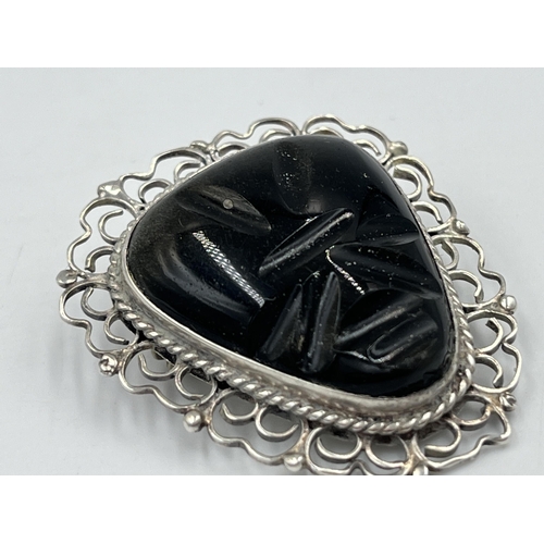 2241 - A Mexican sterling silver and carved golden sheen obsidian brooch