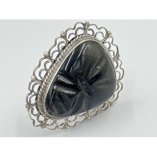 2241 - A Mexican sterling silver and carved golden sheen obsidian brooch