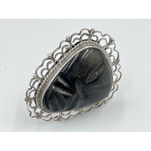 2241 - A Mexican sterling silver and carved golden sheen obsidian brooch