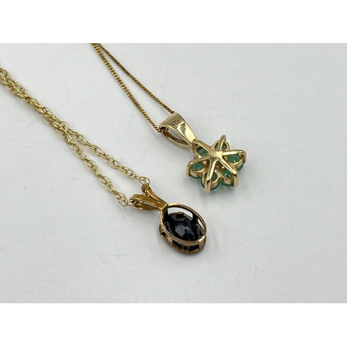 2243 - Two 9ct gold gemstone set pendant necklaces, one emerald and one sapphire - approx. gross weight 2.1... 