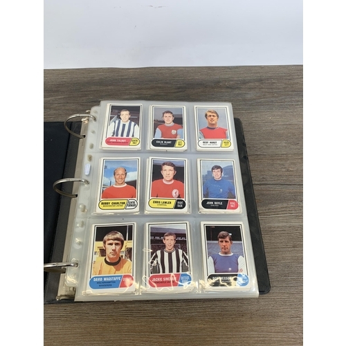 380 - Three albums and two boxes containing a large collection of vintage football collector's cards to in... 