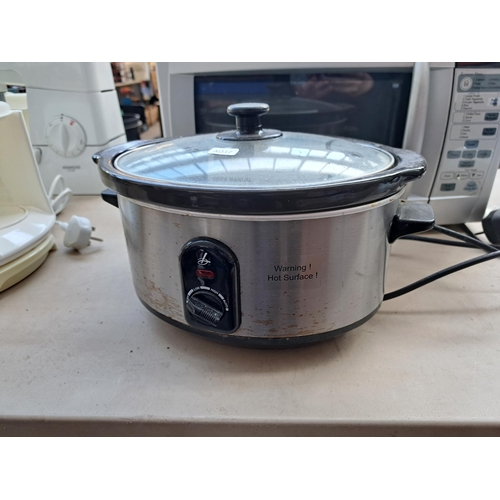 Two items, one LG MS2344BS Wavedom 850w microwave oven and one Lakeland