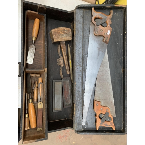 866 - A vintage wooden toolbox containing hand tools