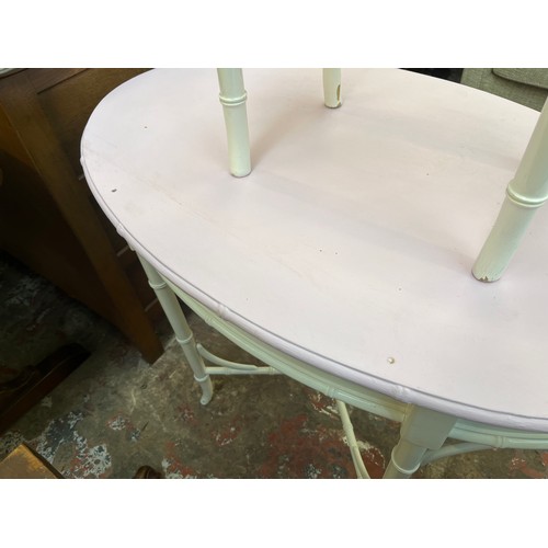 88 - A white painted faux bamboo oval dressing table and stool - approx. 75cm high x 90cm wide x 56cm dee... 