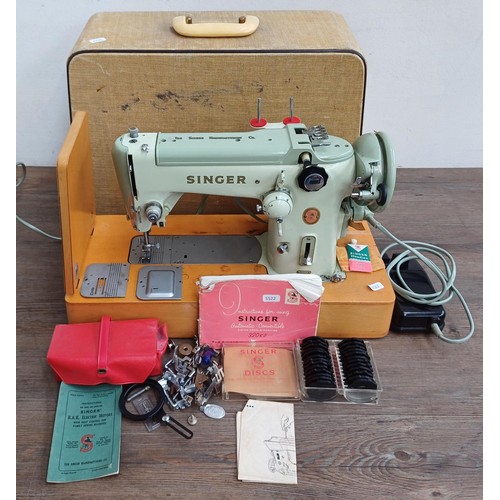 861 - A cased 1960 Singer 320K automatic-convertible swing-needle electric sewing machine with boxed stitc... 