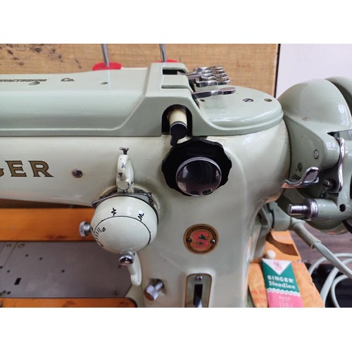 861 - A cased 1960 Singer 320K automatic-convertible swing-needle electric sewing machine with boxed stitc... 