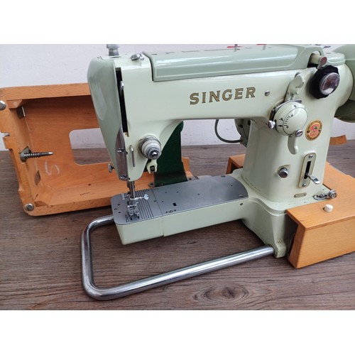 861 - A cased 1960 Singer 320K automatic-convertible swing-needle electric sewing machine with boxed stitc... 