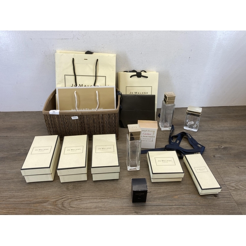 504 - A collection of empty branded boxes and bags to include Jo Malone, Dior, Cartier etc.