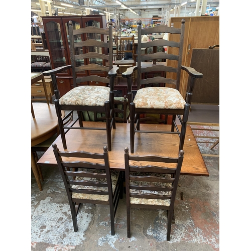 157 - An oak rectangular dining table and six beech ladder back chairs - table approx. 74cm high x 78cm wi... 