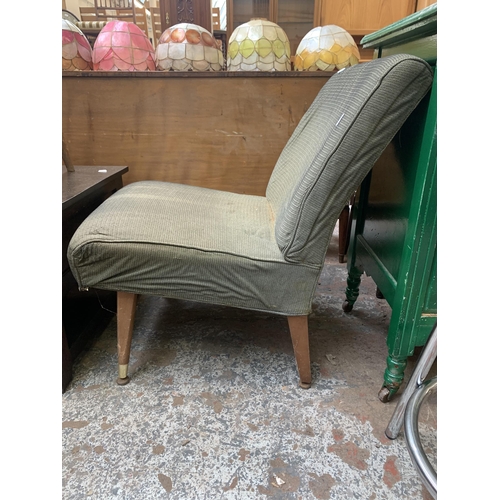 200 - A mid 20th century green fabric upholstered and beech lounge chair - approx. 75cm high x 53cm wide x... 