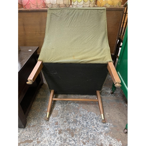 200 - A mid 20th century green fabric upholstered and beech lounge chair - approx. 75cm high x 53cm wide x... 