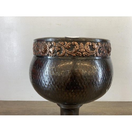 434 - A late 19th/early 20th century hammered copper jardinière - approx. 29cm high