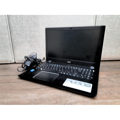 838 - An Acer Aspire F5-571 laptop with charger