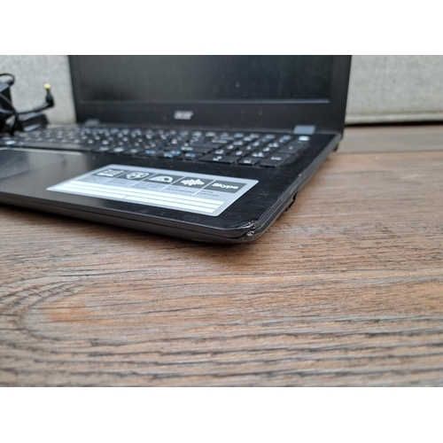 838 - An Acer Aspire F5-571 laptop with charger