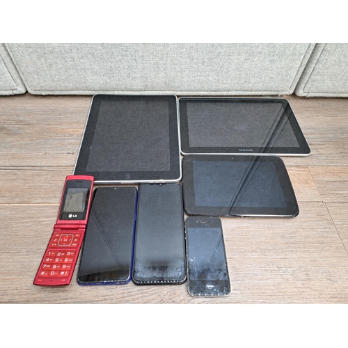 842 - A collection of tablets and phones to include Apple A1219 iPad, Apple A1387 iPhone, Doogee phone, Re... 