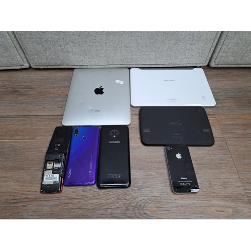 842 - A collection of tablets and phones to include Apple A1219 iPad, Apple A1387 iPhone, Doogee phone, Re... 