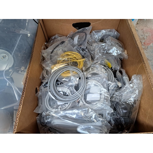 848 - Four boxes containing a large collection of tech related items to include ethernet cables, Garmin sa... 