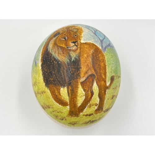 2026 - An ostrich egg with hand painted lion decoration