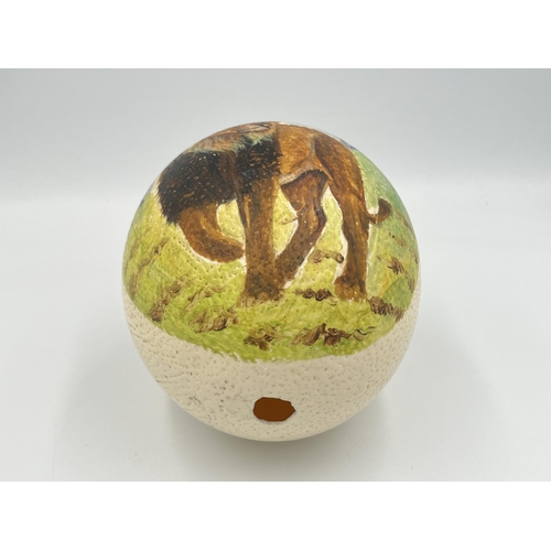 2026 - An ostrich egg with hand painted lion decoration