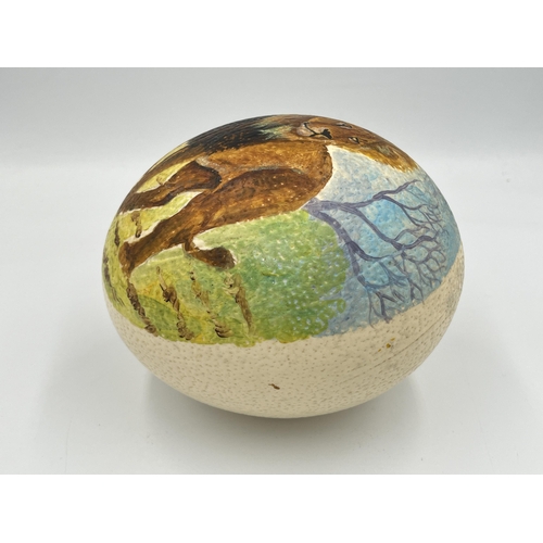 2026 - An ostrich egg with hand painted lion decoration