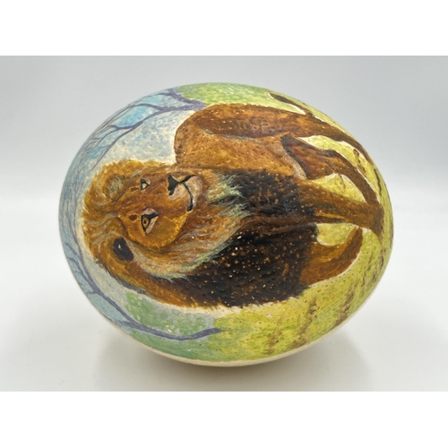 2026 - An ostrich egg with hand painted lion decoration