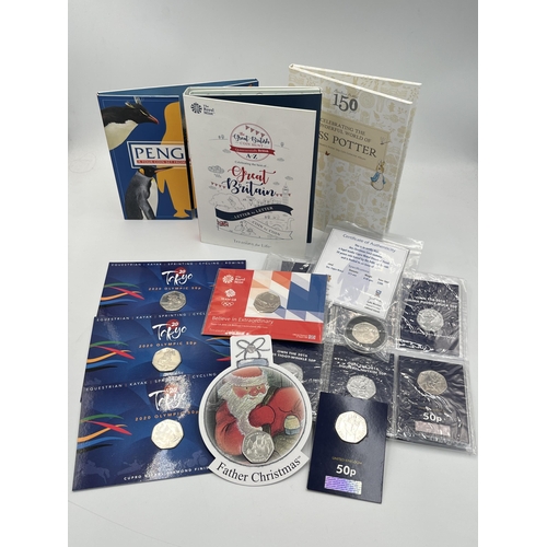 2030 - A collection of British proof 50 pence coins to include Pobjoy Mint Father Christmas, The Royal Mail... 