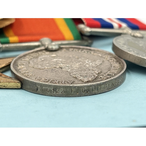 2049 - A WWI and WWII South African medal pair and quadlet presented to 186122 F.C. Liebenberg with origina... 