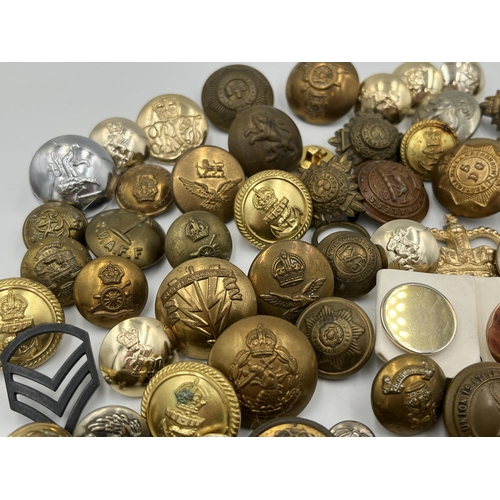 2057 - A large collection of military and police buttons to include Canada etc.