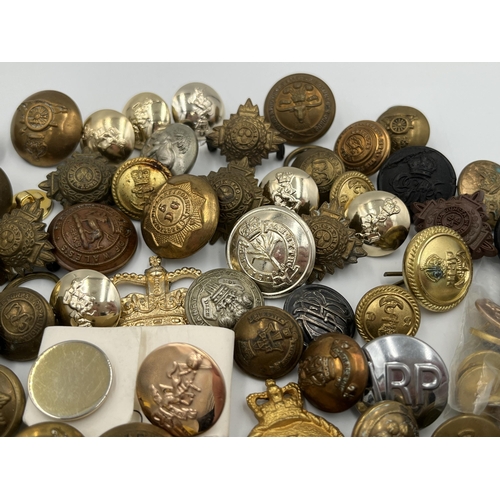 2057 - A large collection of military and police buttons to include Canada etc.