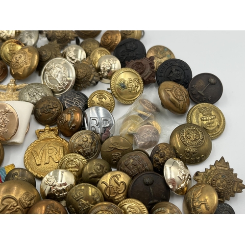 2057 - A large collection of military and police buttons to include Canada etc.