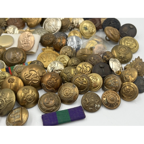 2057 - A large collection of military and police buttons to include Canada etc.