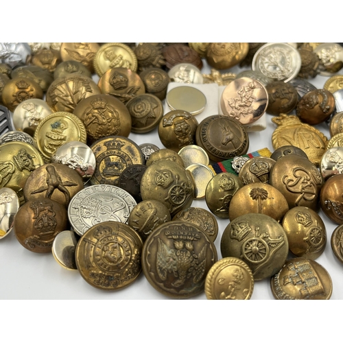 2057 - A large collection of military and police buttons to include Canada etc.