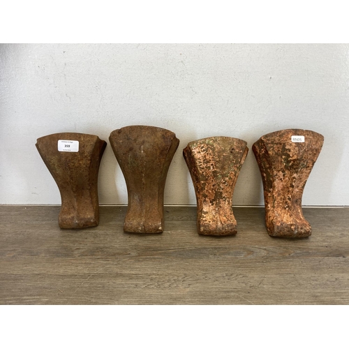 450 - Four Victorian cast iron bath feet - approx. 20cm high