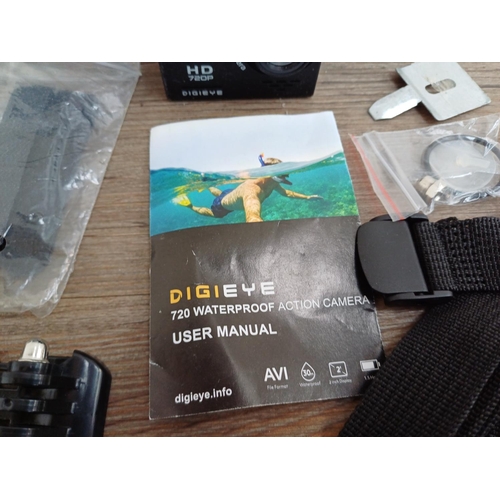 666 - A boxed DigiEye DG-HD72 720P waterproof action camera with accessories and instruction manual