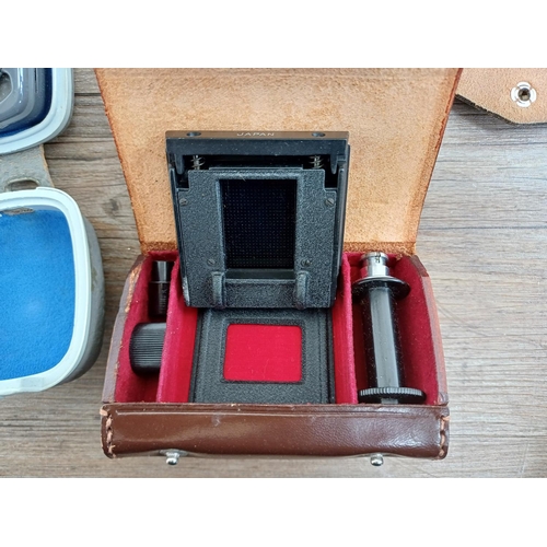 669 - A collection of photography accessories to include Ihagee waist level finder, Zeiss Ikon Ikophot exp... 