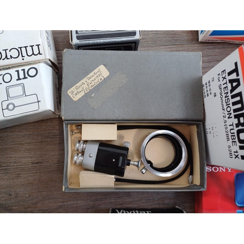 670 - A collection of boxed cameras and photography accessories to include Kodak Brownie 44A, Ihagee exten... 