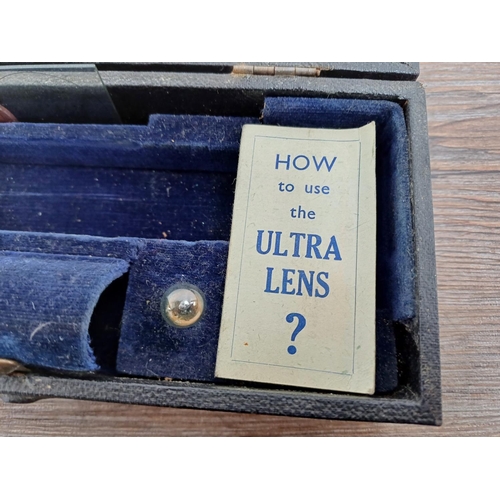 671 - A cased vintage 'The Ultra Lens' pocket magnifier