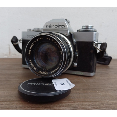 673 - A Minolta XD5 35mm SLR camera fitted with MC Rokkor-PF 1:1.7 f=55mm lens