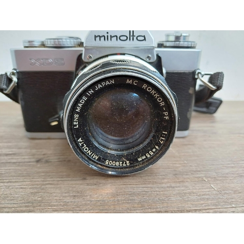 673 - A Minolta XD5 35mm SLR camera fitted with MC Rokkor-PF 1:1.7 f=55mm lens