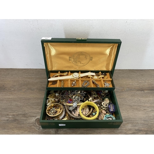 514 - An oriental green jewellery box containing a collection of vintage costume jewellery to include micr... 