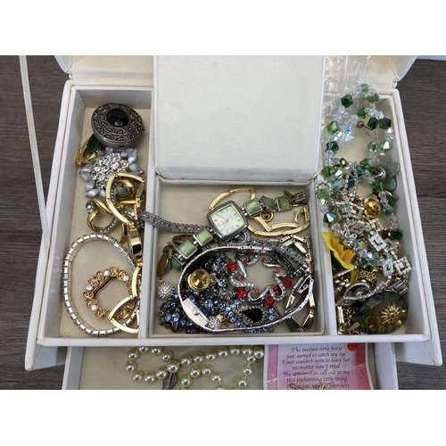 515 - A white jewellery box containing a collection of costume jewellery to include hallmarked silver dres... 