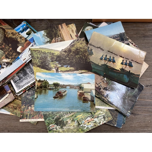 520 - A large collection of vintage postcards