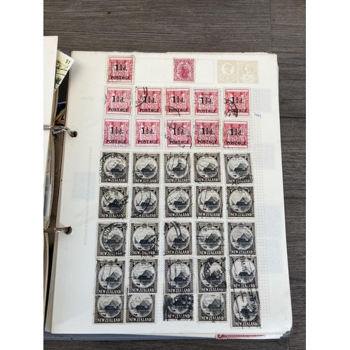 525 - Two stamp albums containing a collection of worldwide stamps to include three British seahorse stamp... 