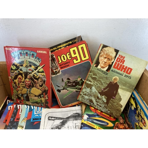 527 - A collection of vintage annuals and comics to include 2000AD, Dr Who, TV21 etc.