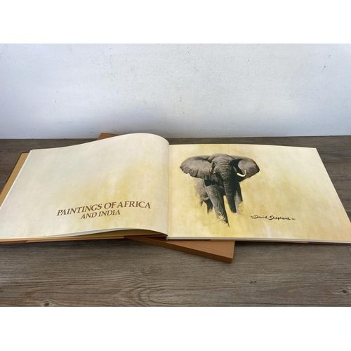 529 - A limited edition 453/506 hand signed David Shepherd Paintings of Africa and India leather bound boo... 