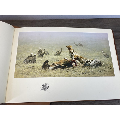 529 - A limited edition 453/506 hand signed David Shepherd Paintings of Africa and India leather bound boo... 